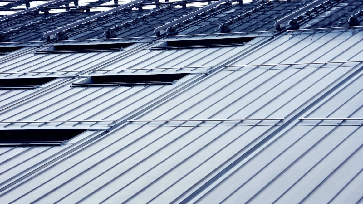 Solar panel mounting solutions for metal roofs